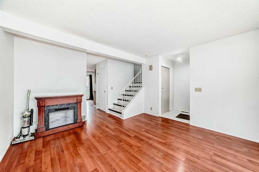 #11-380 Bermuda Drive Nw, Calgary, AB - Indoor With Fireplace