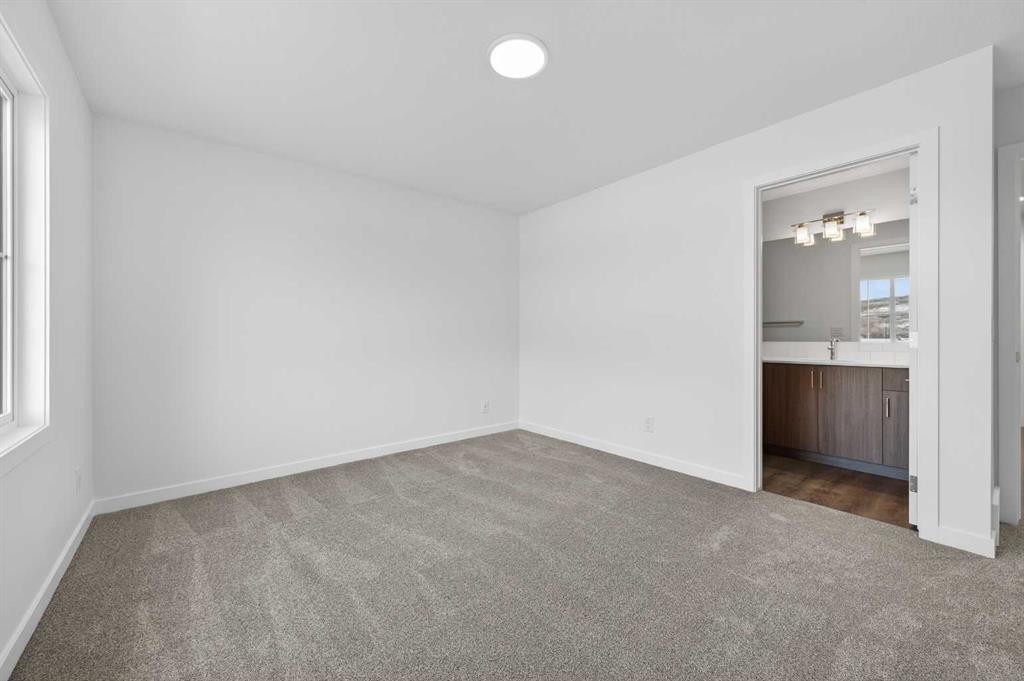 64 Creekside Drive Sw, Calgary, AB - Indoor Photo Showing Other Room