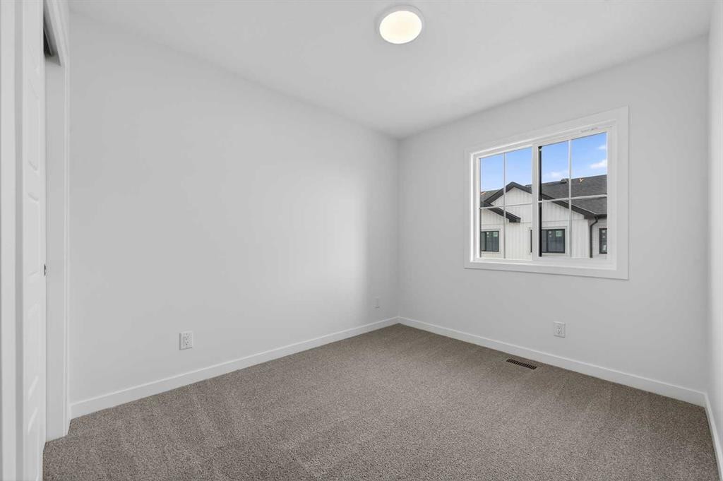 64 Creekside Drive Sw, Calgary, AB - Indoor Photo Showing Other Room
