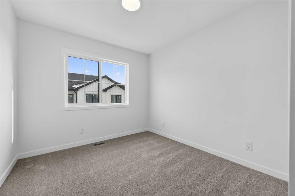 64 Creekside Drive Sw, Calgary, AB - Indoor Photo Showing Other Room