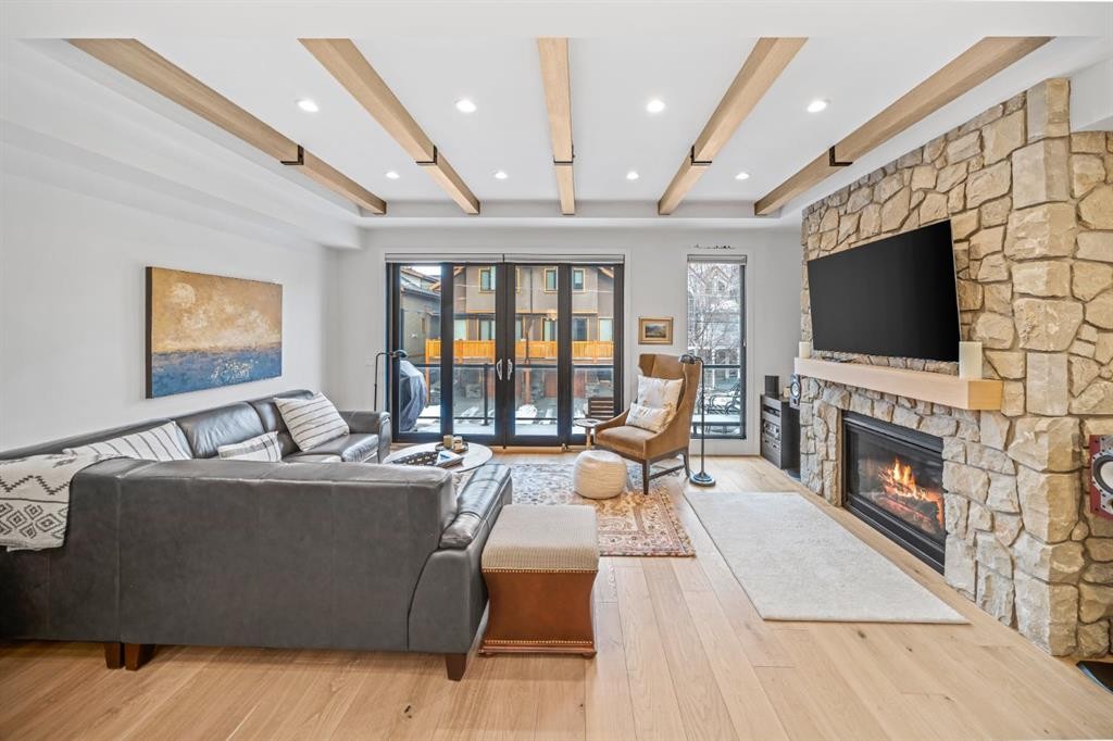 4-810 3Rd Street, Canmore, AB - Indoor Photo Showing Living Room With Fireplace