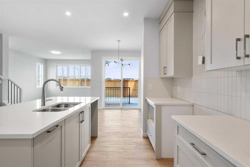 659 Buffaloberry Manor Se, Calgary, AB - Indoor Photo Showing Kitchen With Double Sink