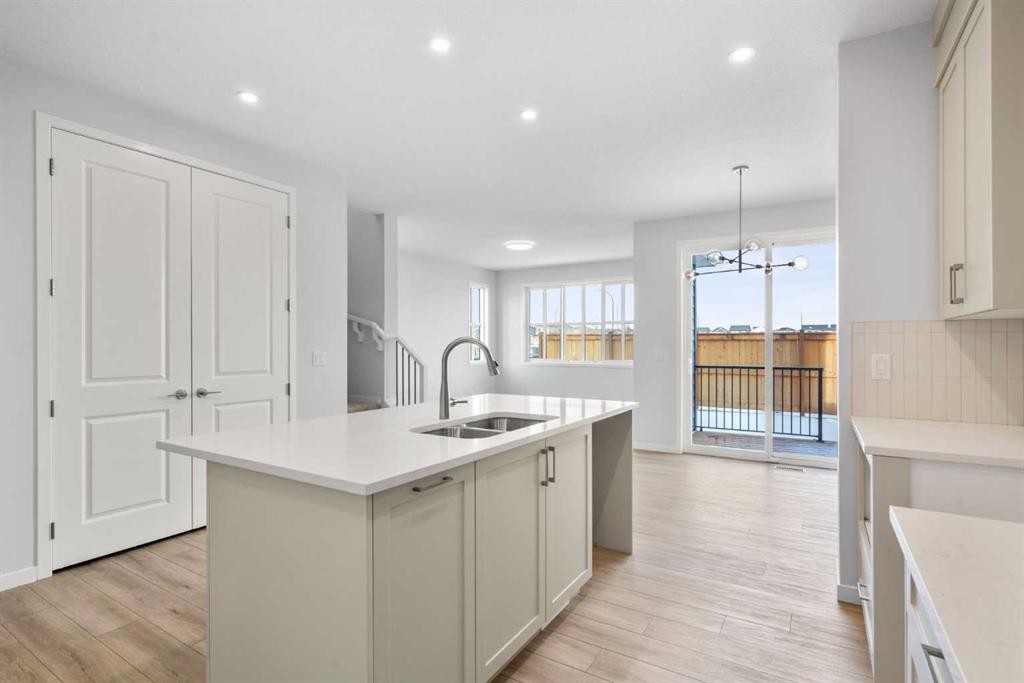 659 Buffaloberry Manor Se, Calgary, AB - Indoor Photo Showing Kitchen With Double Sink