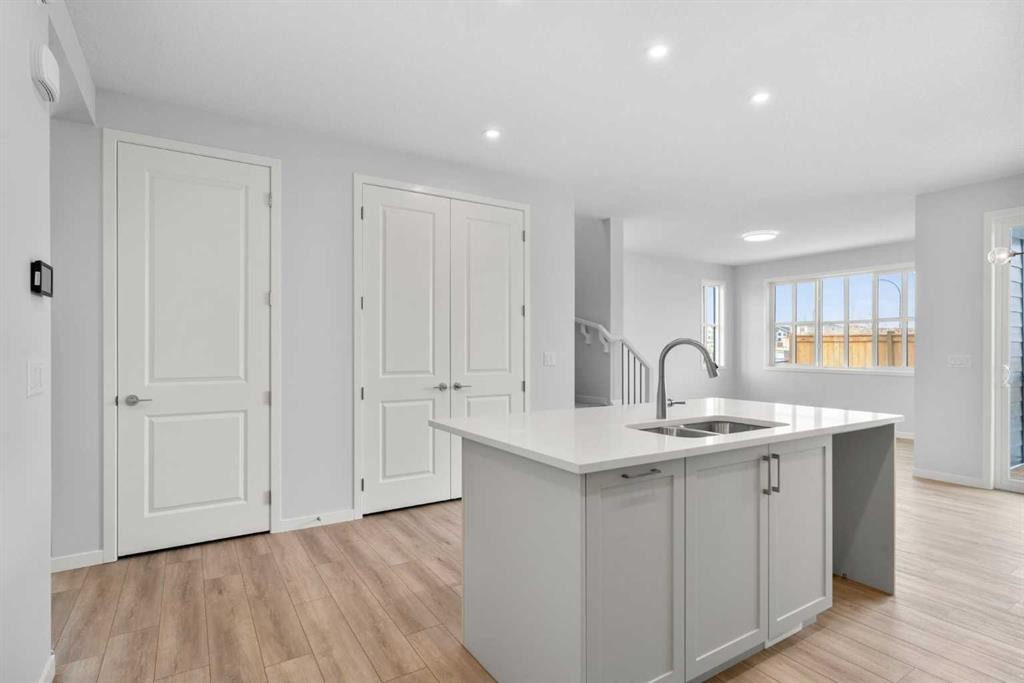 659 Buffaloberry Manor Se, Calgary, AB - Indoor Photo Showing Kitchen With Double Sink
