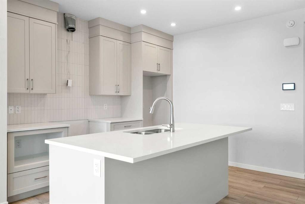 659 Buffaloberry Manor Se, Calgary, AB - Indoor Photo Showing Kitchen With Double Sink