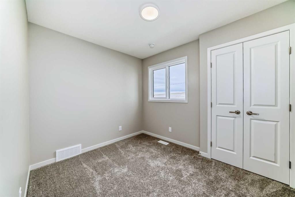 103 Sawgrass Gate Nw, Airdrie, AB - Indoor Photo Showing Other Room