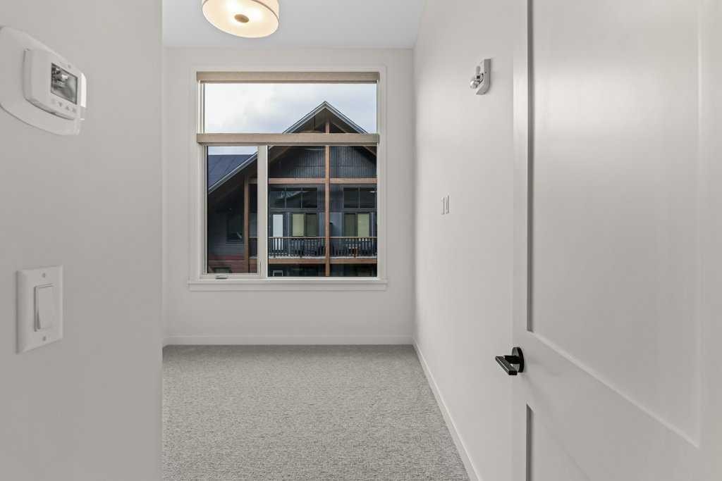 407-1505 Spring Creek Gate, Canmore, AB - Indoor Photo Showing Other Room
