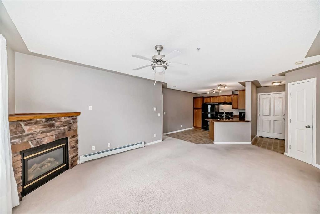 303-369 Rocky Vista Park Nw, Calgary, AB - Indoor Photo Showing Other Room With Fireplace