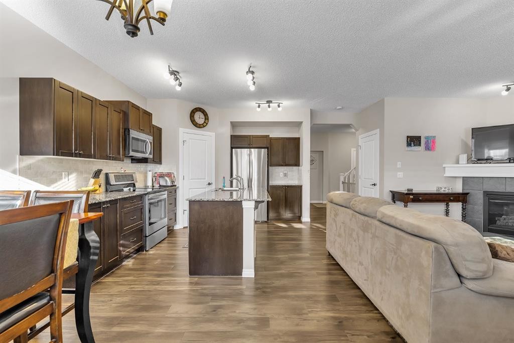 31 Walden Court Se, Calgary, AB - Indoor Photo Showing Kitchen With Fireplace With Stainless Steel Kitchen With Upgraded Kitchen