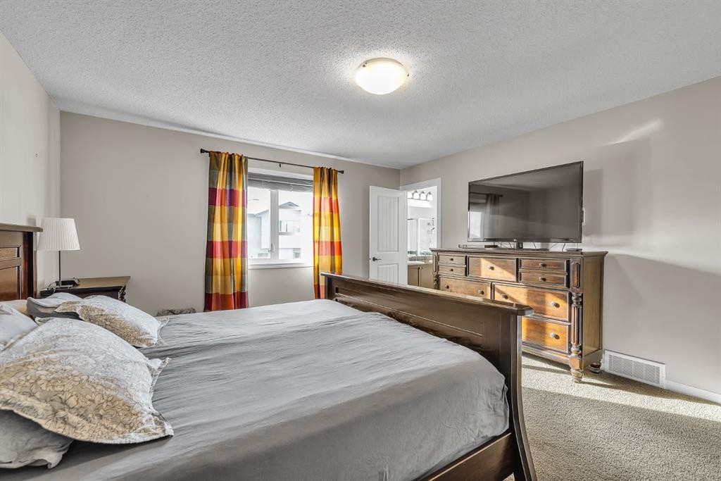 31 Walden Court Se, Calgary, AB - Indoor Photo Showing Bedroom