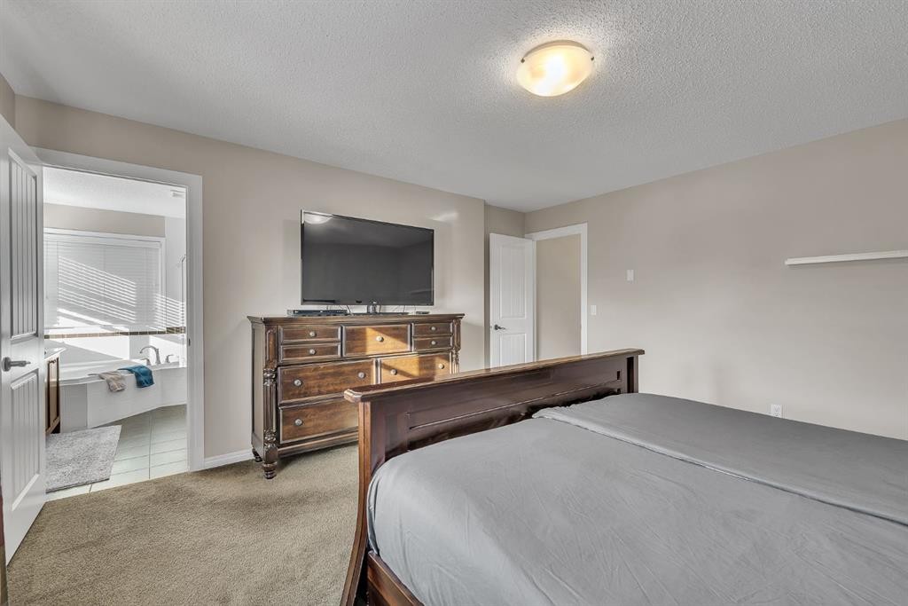 31 Walden Court Se, Calgary, AB - Indoor Photo Showing Bedroom