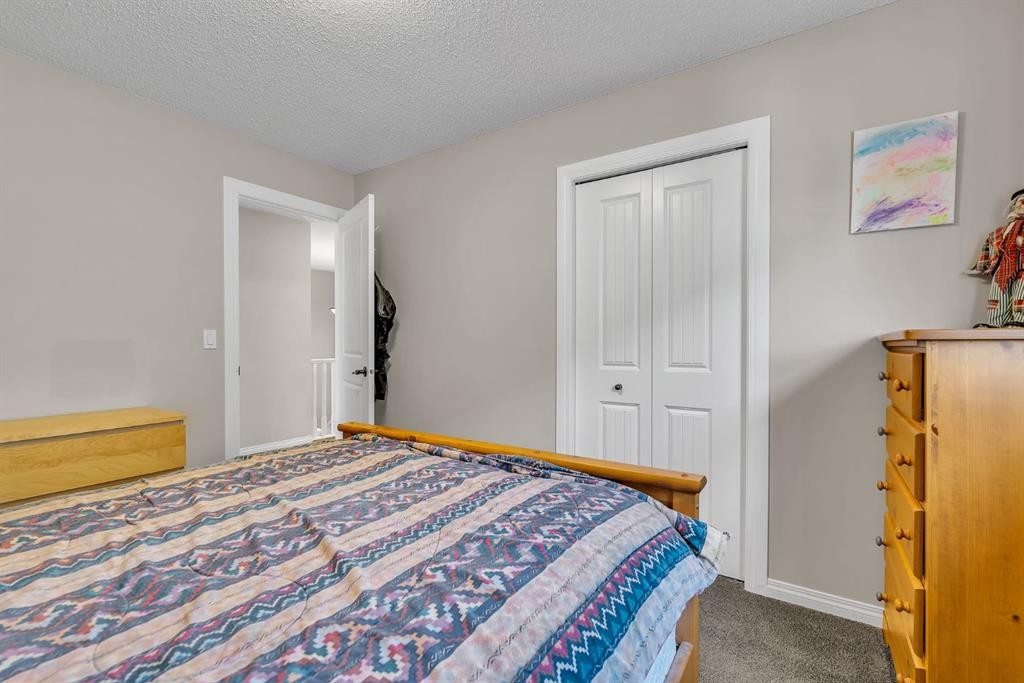 31 Walden Court Se, Calgary, AB - Indoor Photo Showing Bedroom