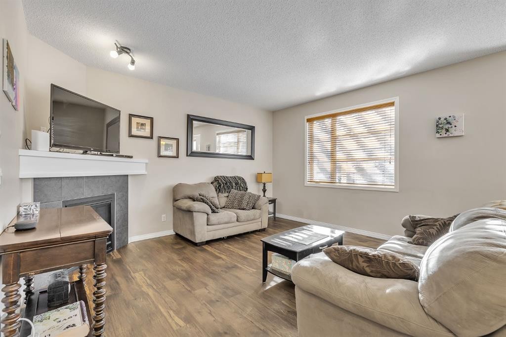 31 Walden Court Se, Calgary, AB - Indoor Photo Showing Living Room With Fireplace