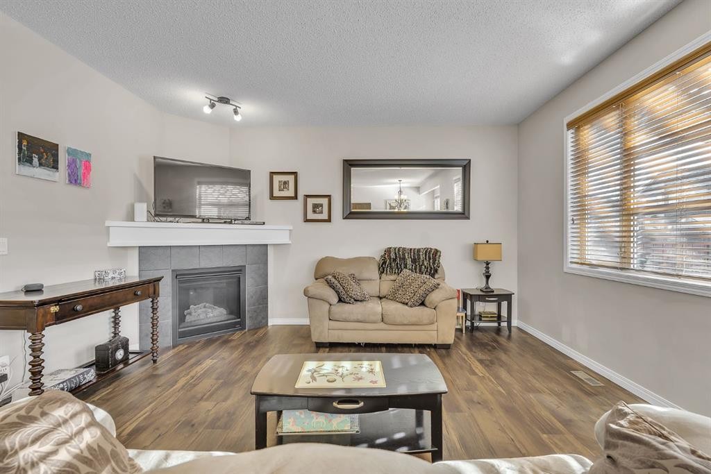 31 Walden Court Se, Calgary, AB - Indoor Photo Showing Living Room With Fireplace