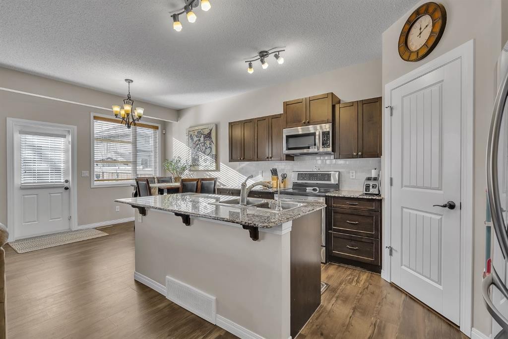31 Walden Court Se, Calgary, AB - Indoor Photo Showing Kitchen With Double Sink With Upgraded Kitchen