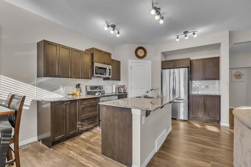 31 Walden Court Se, Calgary, AB - Indoor Photo Showing Kitchen With Stainless Steel Kitchen With Upgraded Kitchen