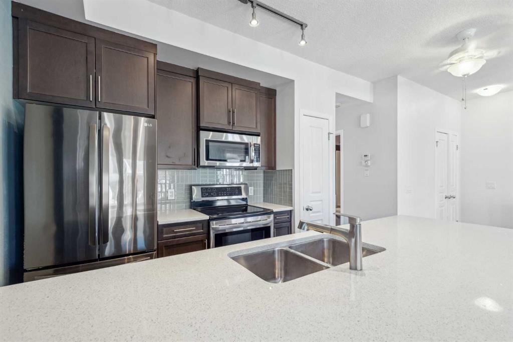 1006 Auburn Bay Square Se, Calgary, AB - Indoor Photo Showing Kitchen With Stainless Steel Kitchen With Double Sink With Upgraded Kitchen