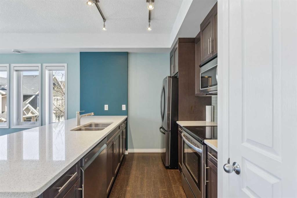 1006 Auburn Bay Square Se, Calgary, AB - Indoor Photo Showing Kitchen With Stainless Steel Kitchen With Double Sink With Upgraded Kitchen
