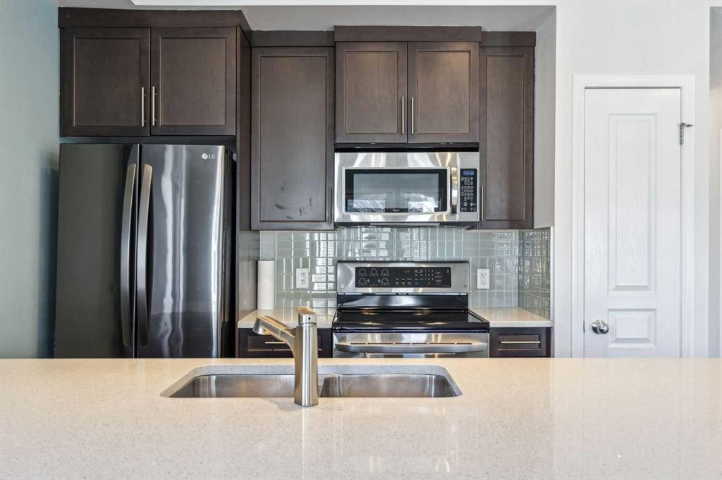 1006 Auburn Bay Square Se, Calgary, AB - Indoor Photo Showing Kitchen With Stainless Steel Kitchen With Double Sink With Upgraded Kitchen
