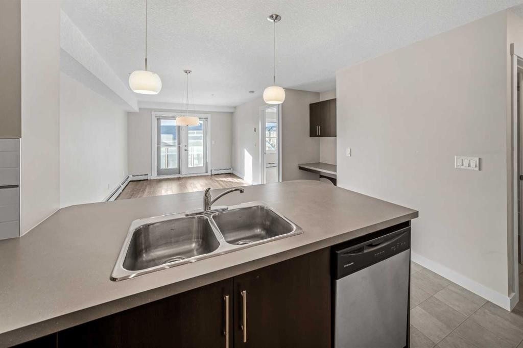 304-2300 Evanston Square Nw, Calgary, AB - Indoor Photo Showing Kitchen With Double Sink