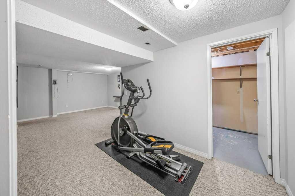 2140 146 Avenue Se, Calgary, AB - Indoor Photo Showing Gym Room