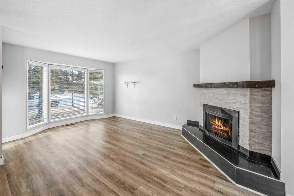 2140 146 Avenue Se, Calgary, AB - Indoor Photo Showing Living Room With Fireplace