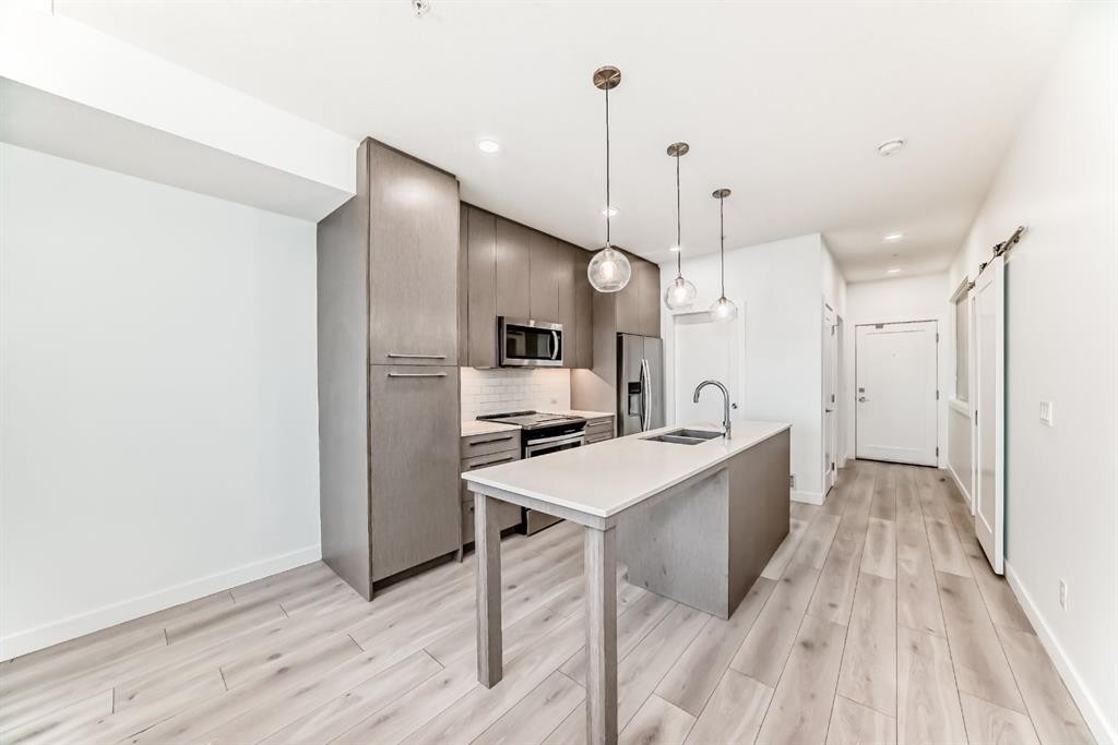1308-76 Cornerstone Passage Ne, Calgary, AB - Indoor Photo Showing Kitchen With Double Sink With Upgraded Kitchen