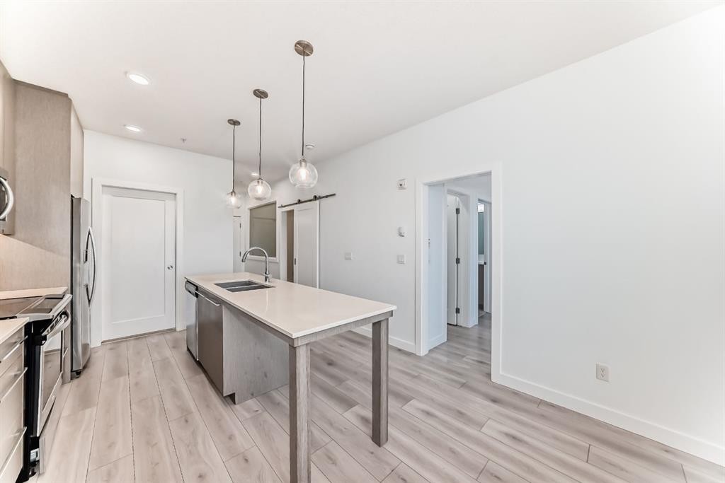 1308-76 Cornerstone Passage Ne, Calgary, AB - Indoor Photo Showing Kitchen With Double Sink With Upgraded Kitchen