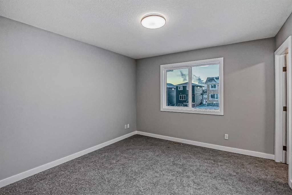 39 Agate Road, Cochrane, AB - Indoor Photo Showing Other Room
