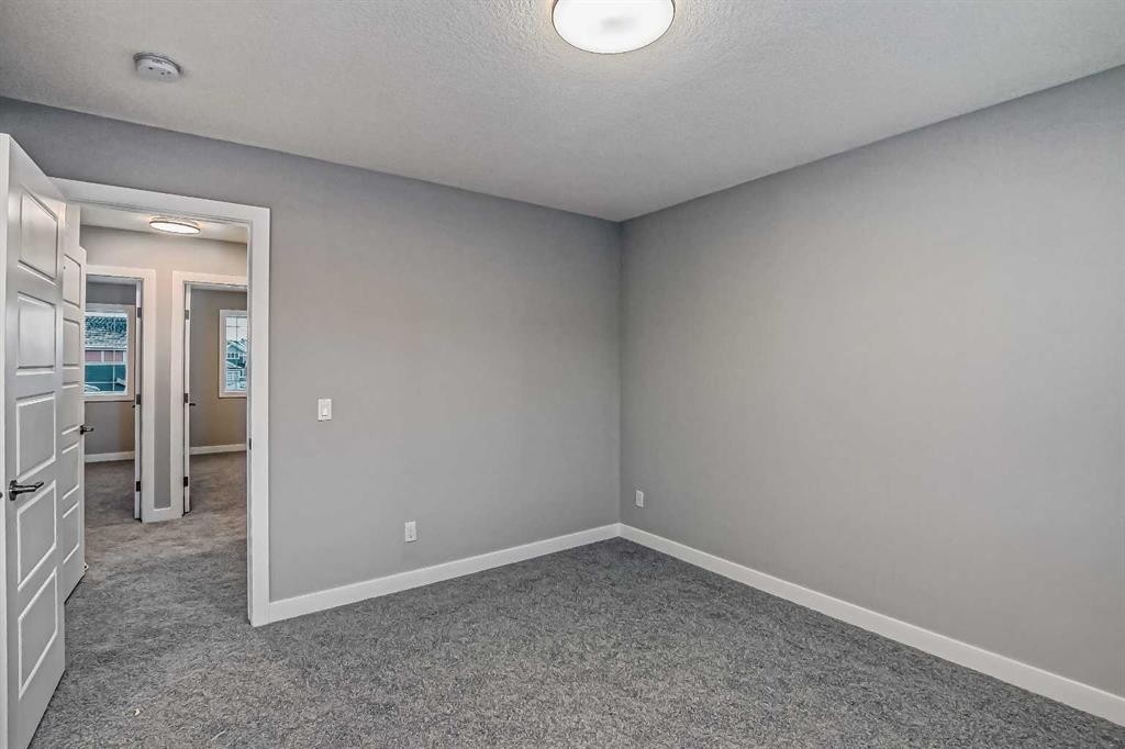 39 Agate Road, Cochrane, AB - Indoor Photo Showing Other Room