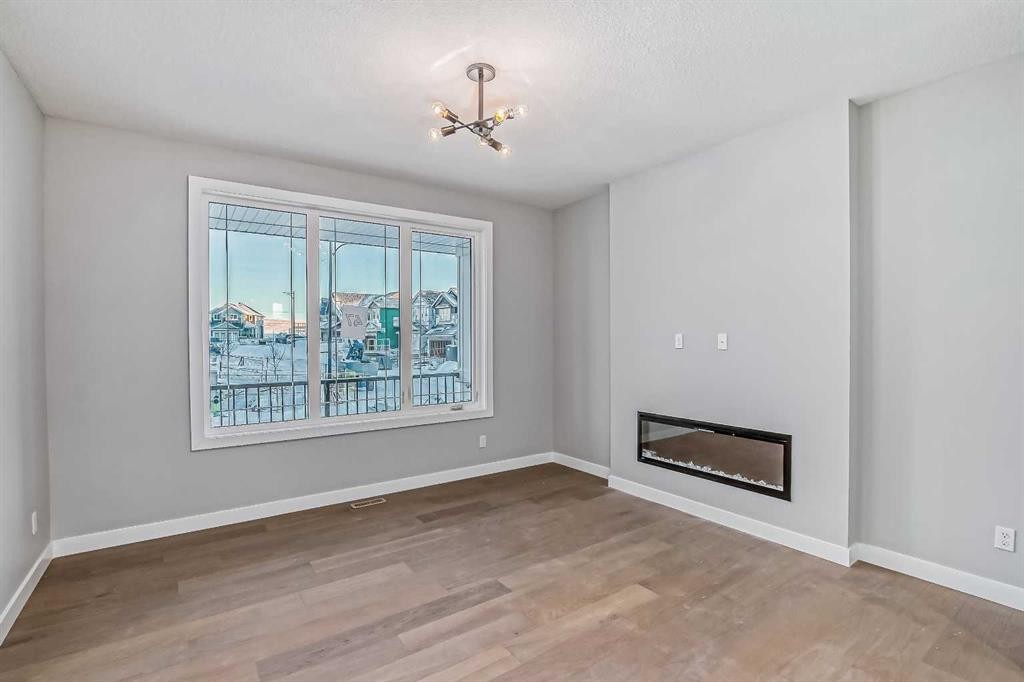 39 Agate Road, Cochrane, AB - Indoor With Fireplace
