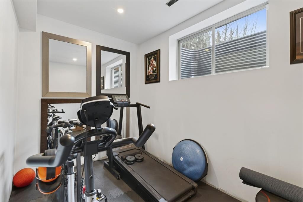 105 Riviera Crescent, Cochrane, AB - Indoor Photo Showing Gym Room