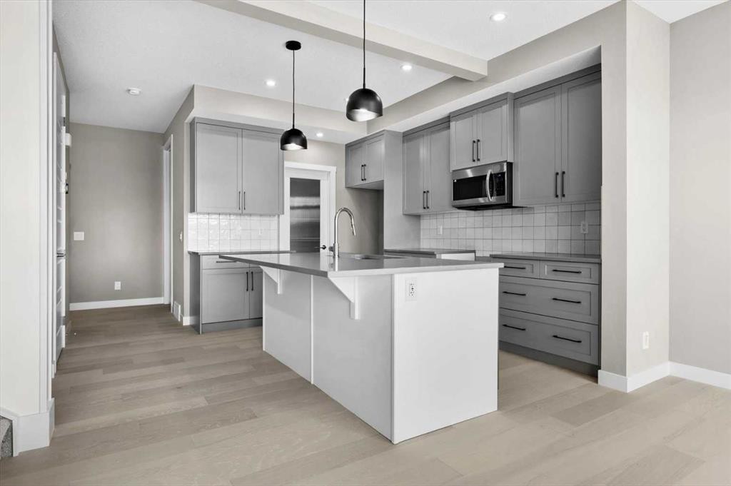 8 Topaz Place, Cochrane, AB - Indoor Photo Showing Kitchen With Upgraded Kitchen