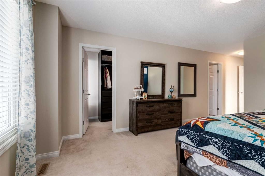 26 Mount Rae Terrace, Okotoks, AB - Indoor Photo Showing Bedroom