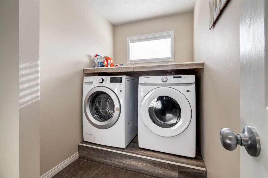 26 Mount Rae Terrace, Okotoks, AB - Indoor Photo Showing Laundry Room