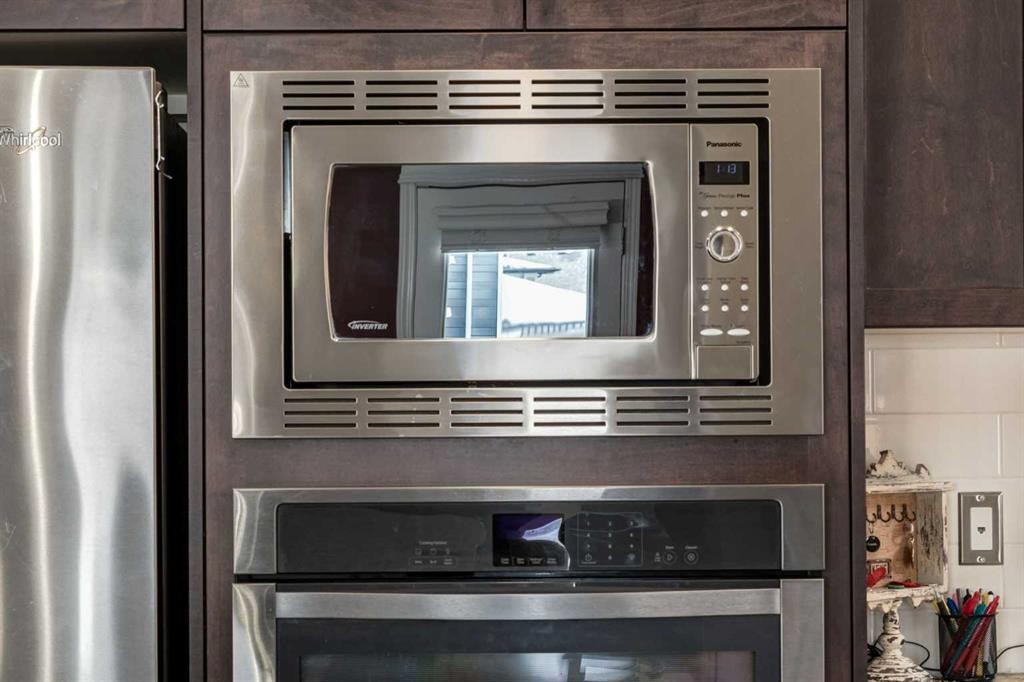 26 Mount Rae Terrace, Okotoks, AB - Indoor Photo Showing Kitchen With Stainless Steel Kitchen