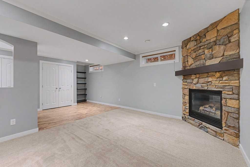 88 Somerside Common Sw, Calgary, AB - Indoor With Fireplace