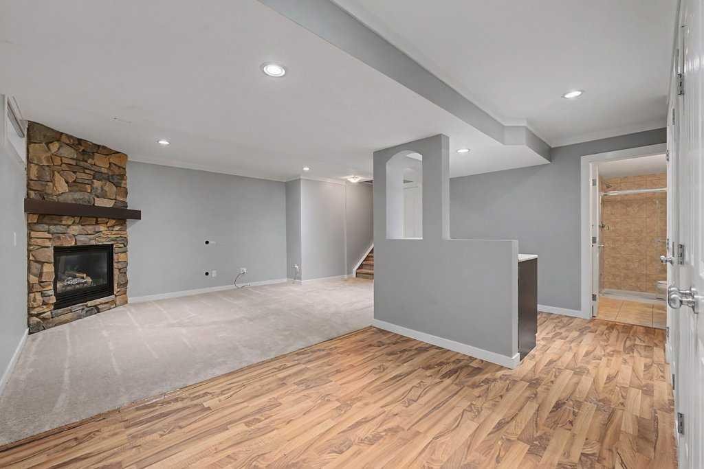88 Somerside Common Sw, Calgary, AB - Indoor With Fireplace