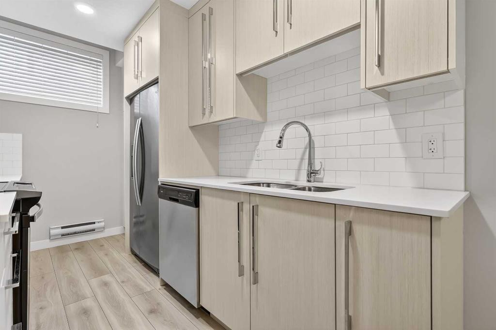 128 Corner Meadows Gate Ne, Calgary, AB - Indoor Photo Showing Kitchen With Double Sink