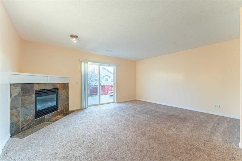 224 Highland Circle, Strathmore, AB - Indoor With Fireplace