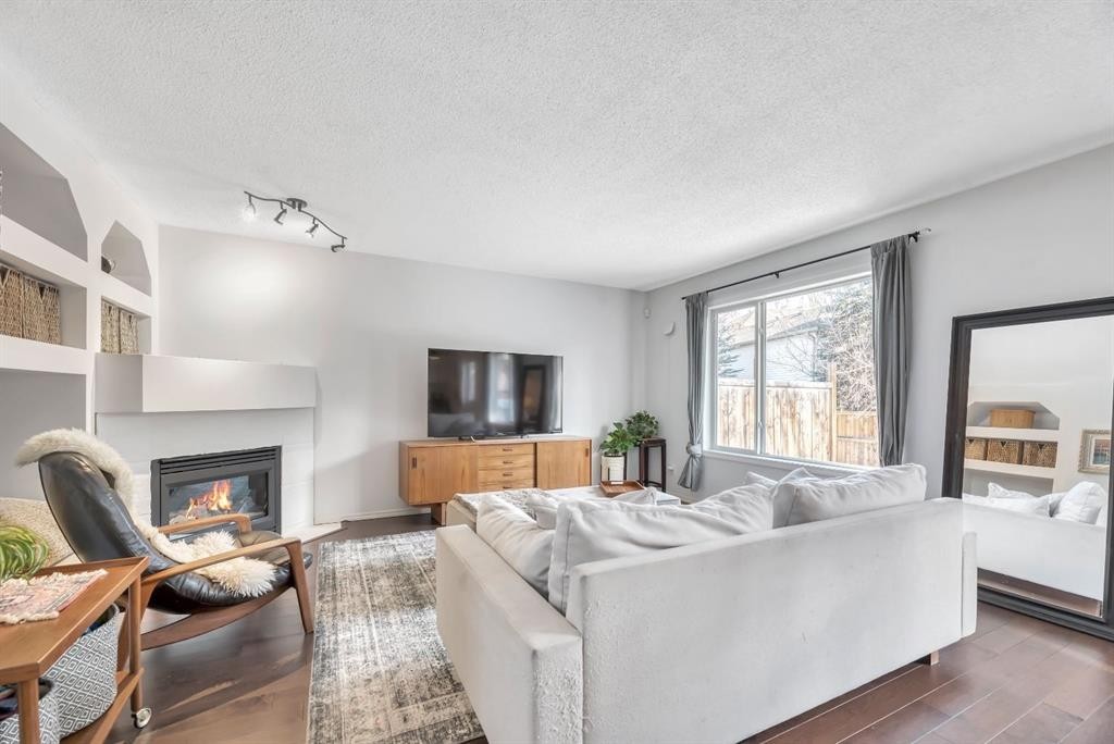 249 Mt.Douglas Circle Se, Calgary, AB - Indoor Photo Showing Living Room With Fireplace