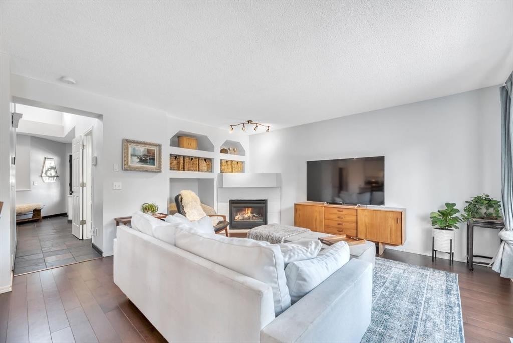 249 Mt.Douglas Circle Se, Calgary, AB - Indoor Photo Showing Living Room With Fireplace
