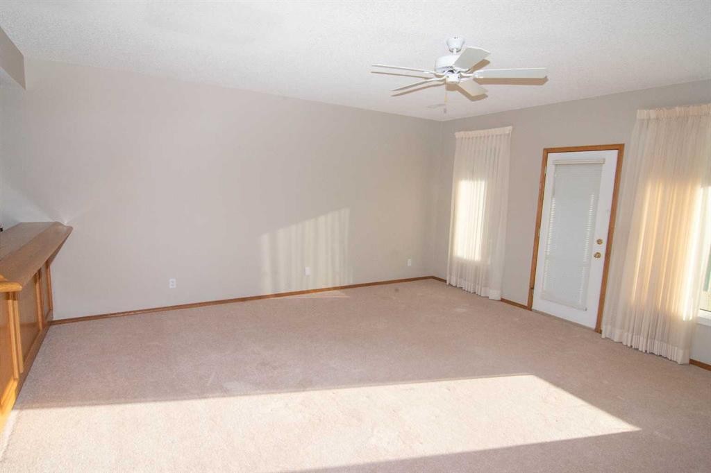 16 Eagleview Heights Nw, Cochrane, AB - Indoor Photo Showing Other Room