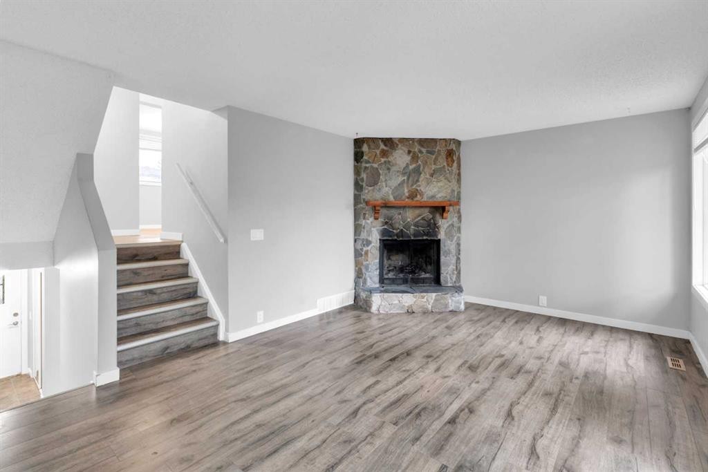 1418 Ranchlands Road Nw, Calgary, AB - Indoor Photo Showing Living Room With Fireplace