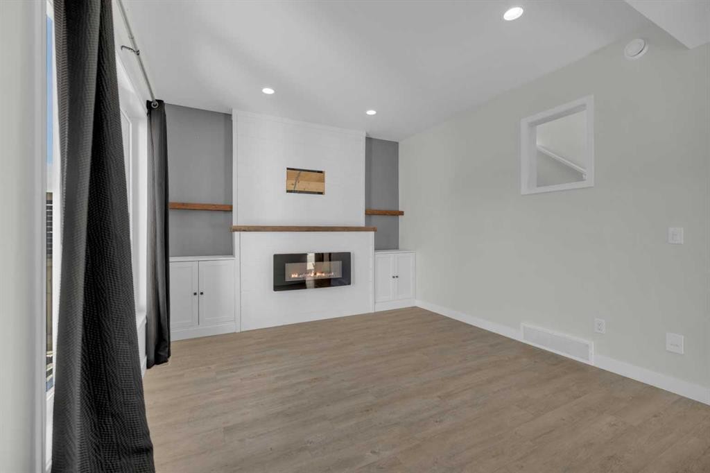 85 Reynolds Road, Sylvan Lake, AB - Indoor With Fireplace
