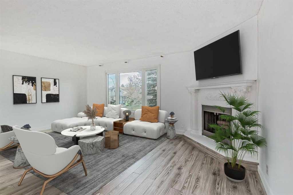 39 Bermuda Drive, Calgary, AB - Indoor Photo Showing Living Room With Fireplace