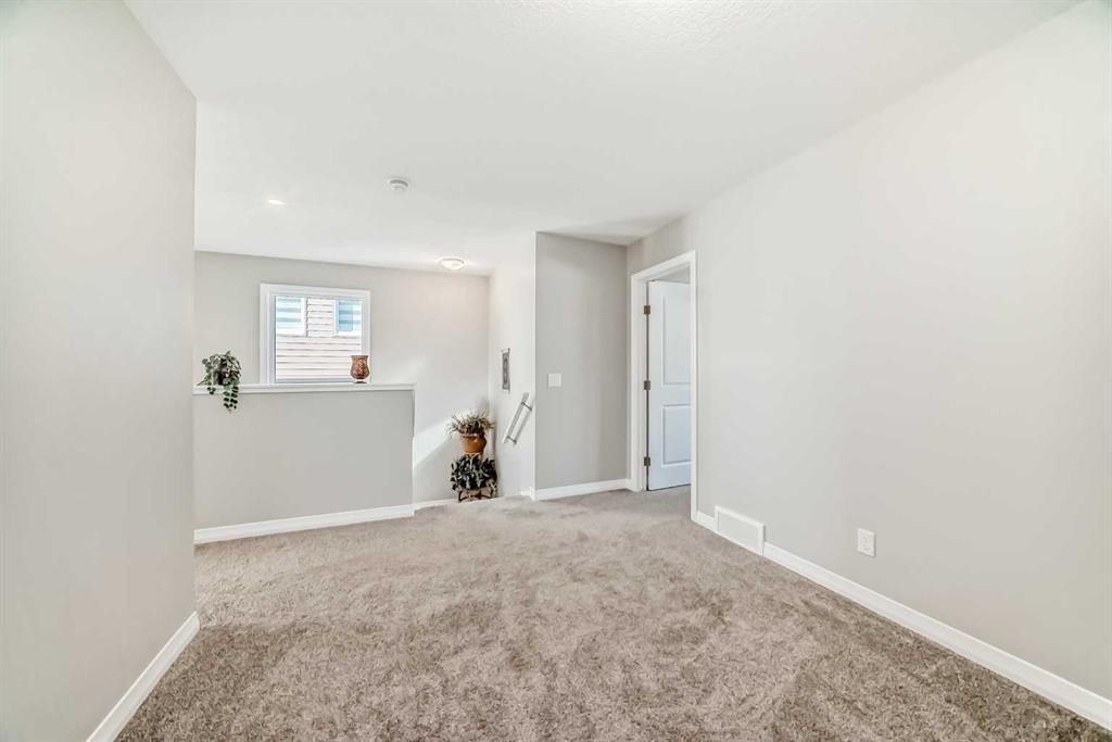 615 Kingsmere Way Se, Airdrie, AB - Indoor Photo Showing Other Room