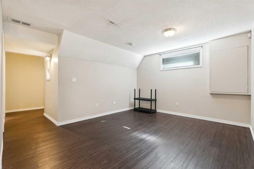 73 Rocky Ridge Heath Nw, Calgary, AB - Indoor Photo Showing Other Room