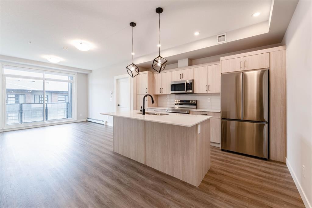 2312-55 Lucas Way Nw, Calgary, AB - Indoor Photo Showing Kitchen With Stainless Steel Kitchen With Upgraded Kitchen