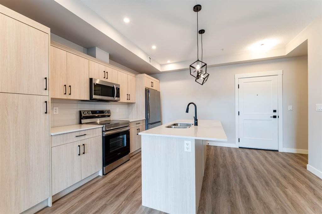 2312-55 Lucas Way Nw, Calgary, AB - Indoor Photo Showing Kitchen With Stainless Steel Kitchen With Double Sink With Upgraded Kitchen